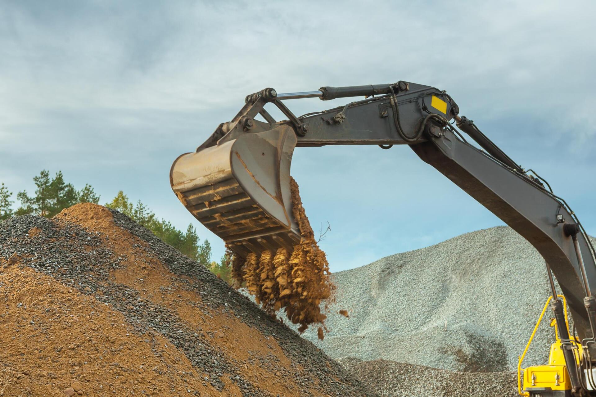 Excavator performing lot grubbing in Nanaimo BC